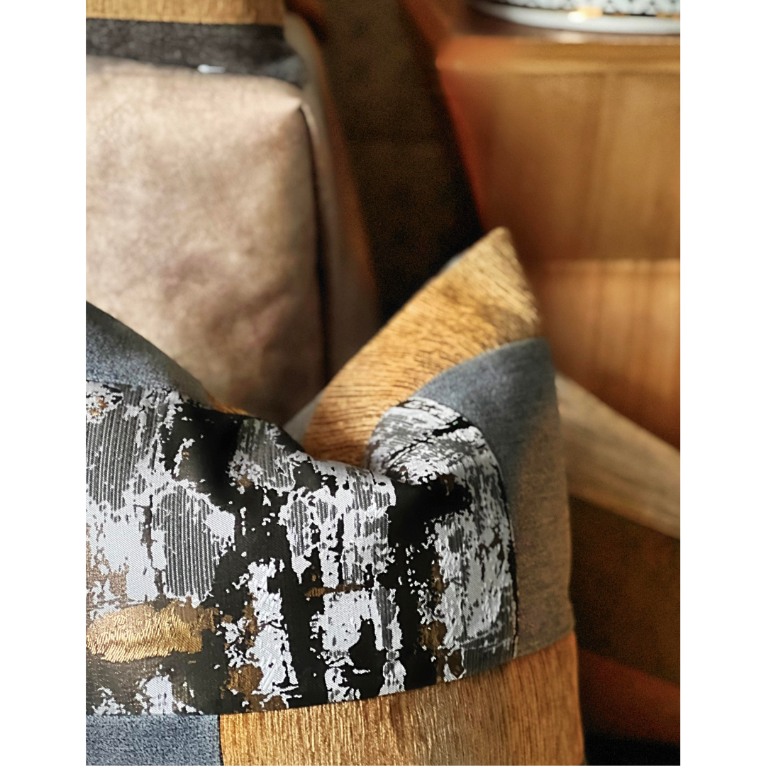 gray and gold metallic pillow