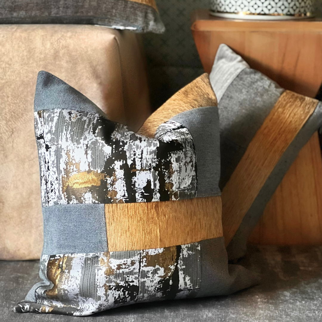 gray and gold pillow