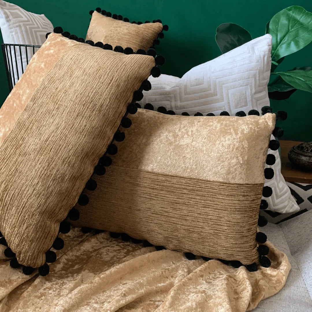 black and gold pillow by EmbellyshHome