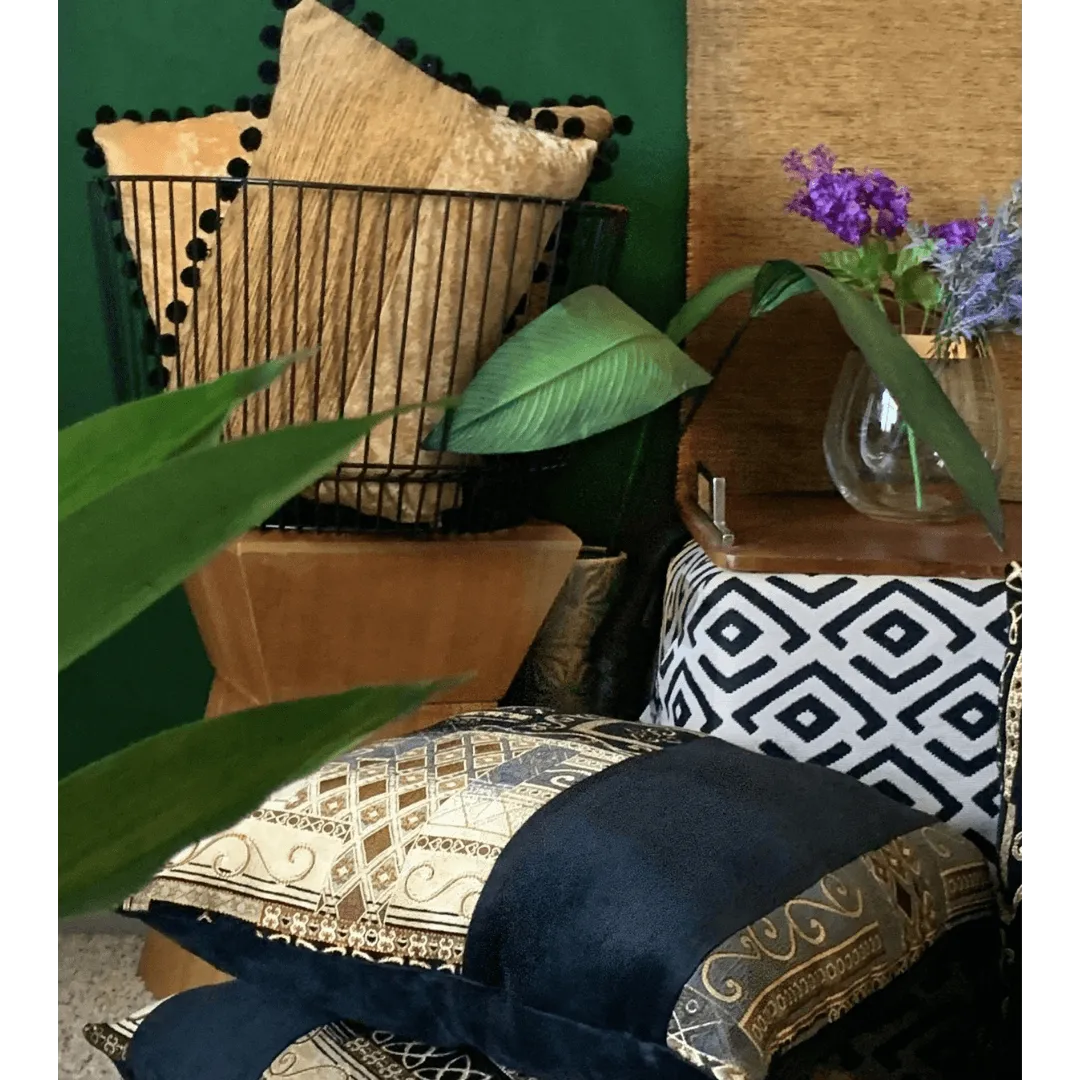 black and gold pillow by EmbellyshHome