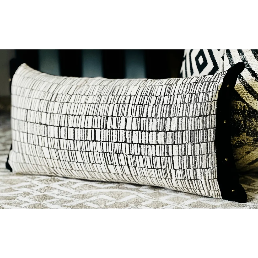 black and white pillow with studs