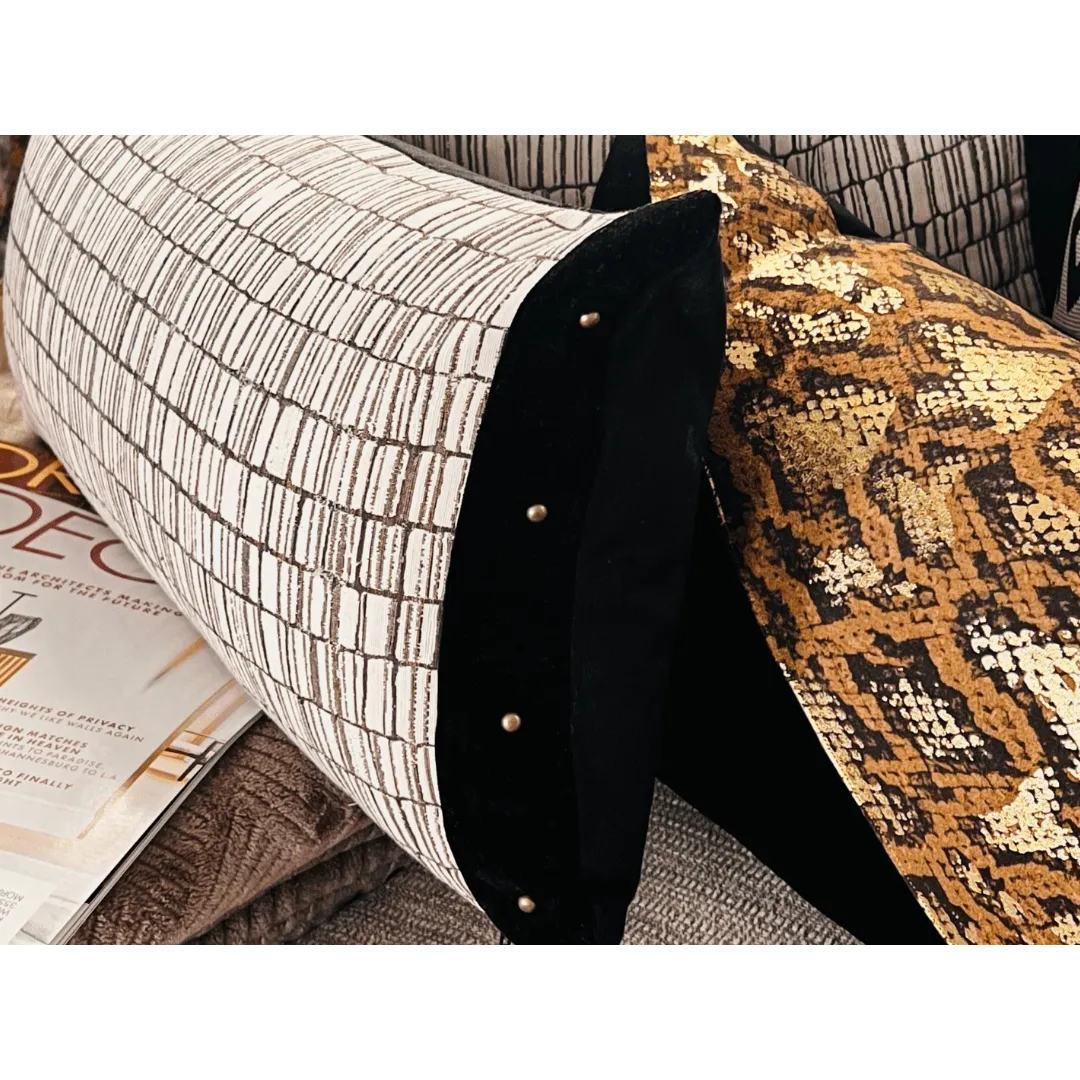 black and white pillow with studs