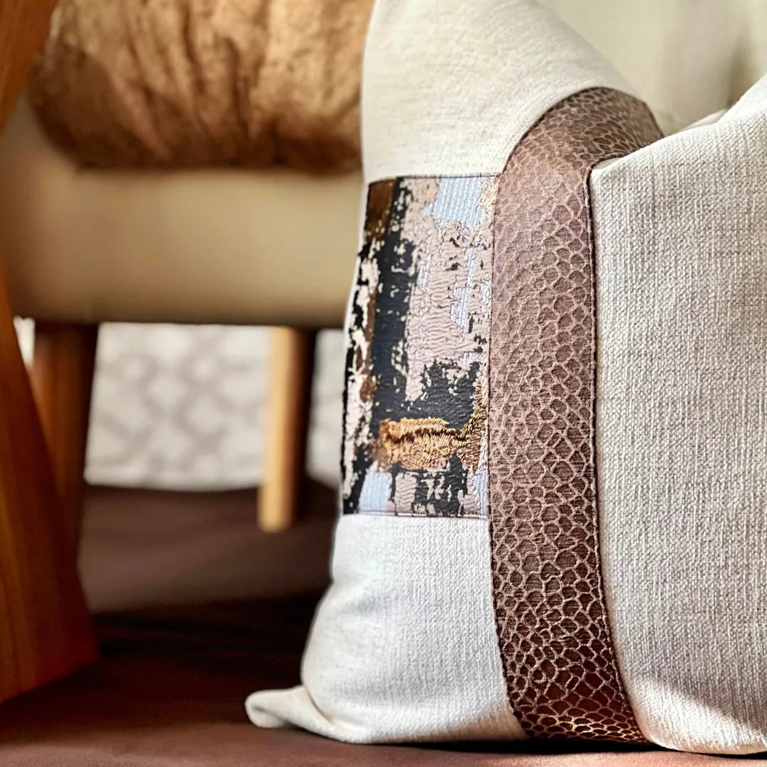 beige and brown metallic pillow