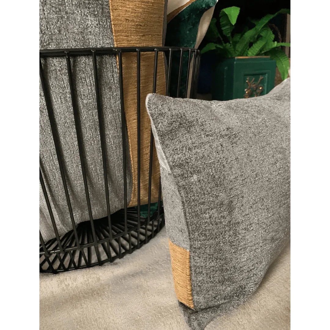 gray and gold lumbar pillow