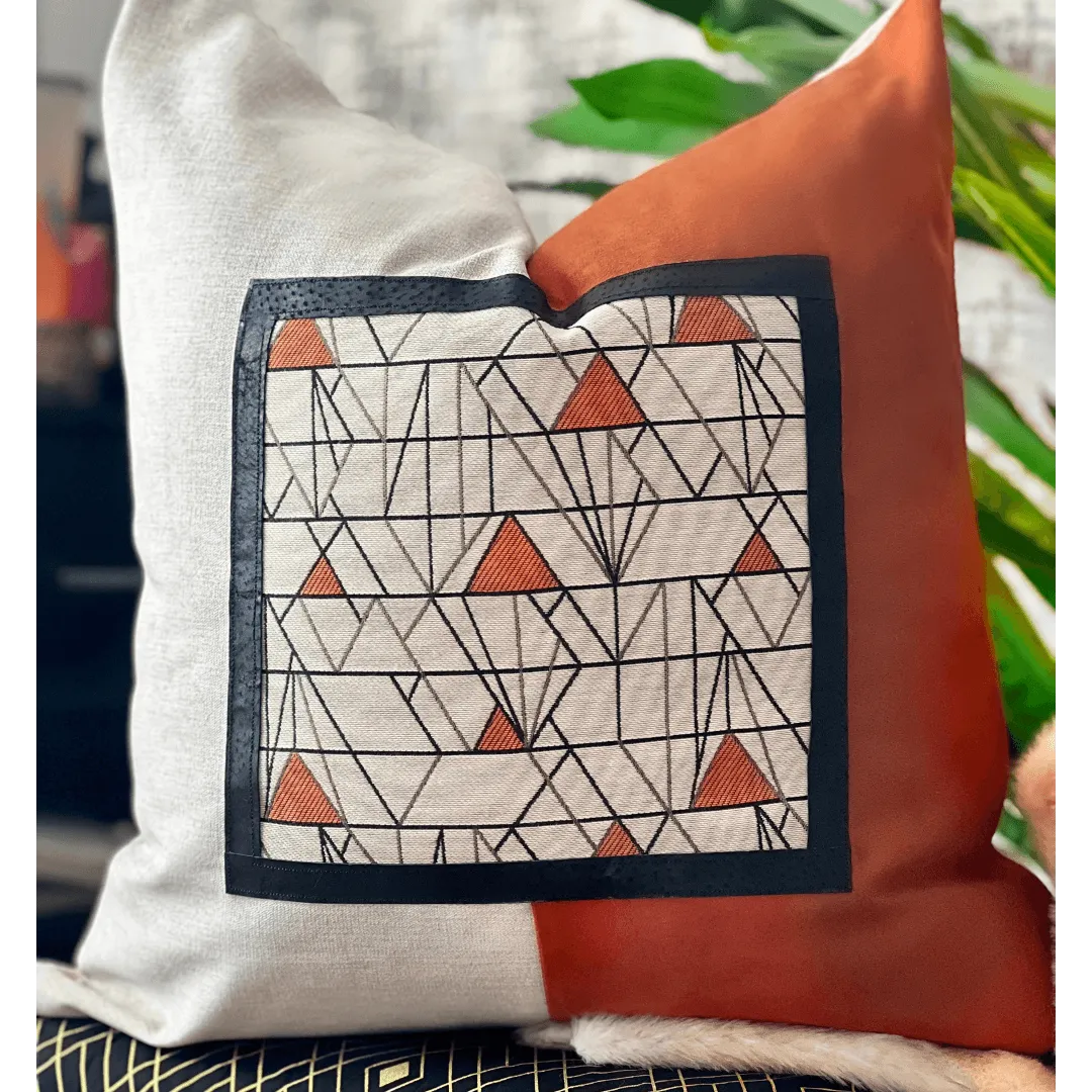 orange and beige art deco pillow
